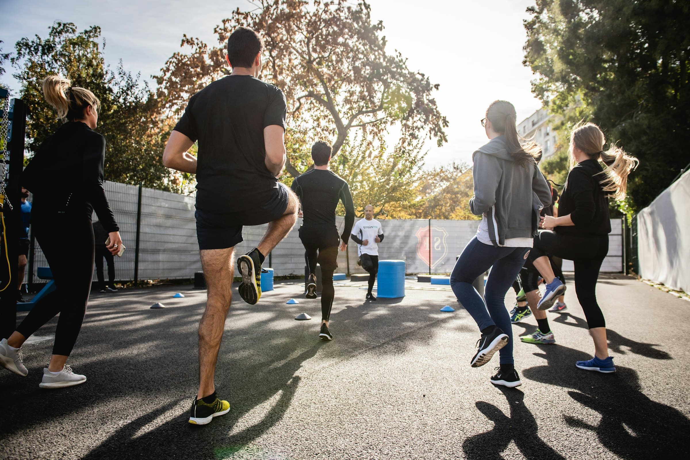 A workplace team training together outdoors